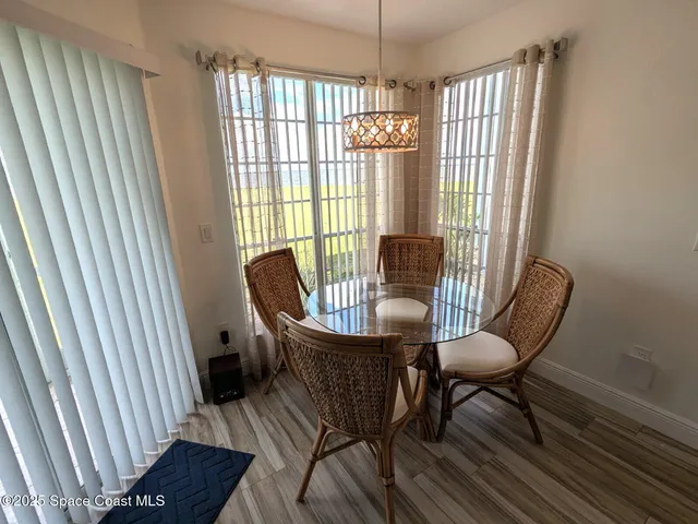 a view of a livingroom with furniture and a window