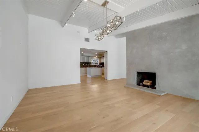 a large kitchen with stainless steel appliances granite countertop a large counter top and a stove