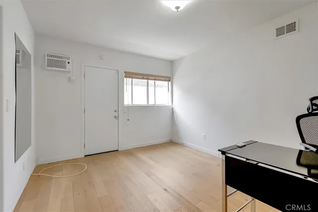 a view of an empty room with empty shelves