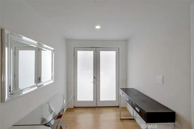 wooden floor and an empty room with wooden floor and a window