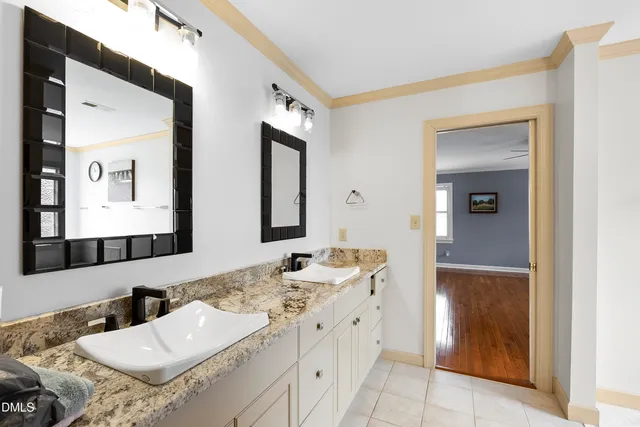 a view of a dining room with furniture wooden floor and chandelier