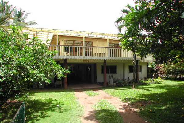 4445 Alamoo Road Hanalei, HI 96714 - Photo 3 of 6 a view of a house with a yard and potted plants