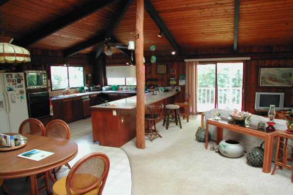 4445 Alamoo Road Hanalei, HI 96714 - Photo 5 of 6 a dining room with furniture window and wooden floor