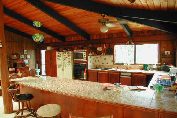 4445 Alamoo Road Hanalei, HI 96714 - Photo 6 of 6 a kitchen with stainless steel appliances granite countertop sink stove and granite counter top