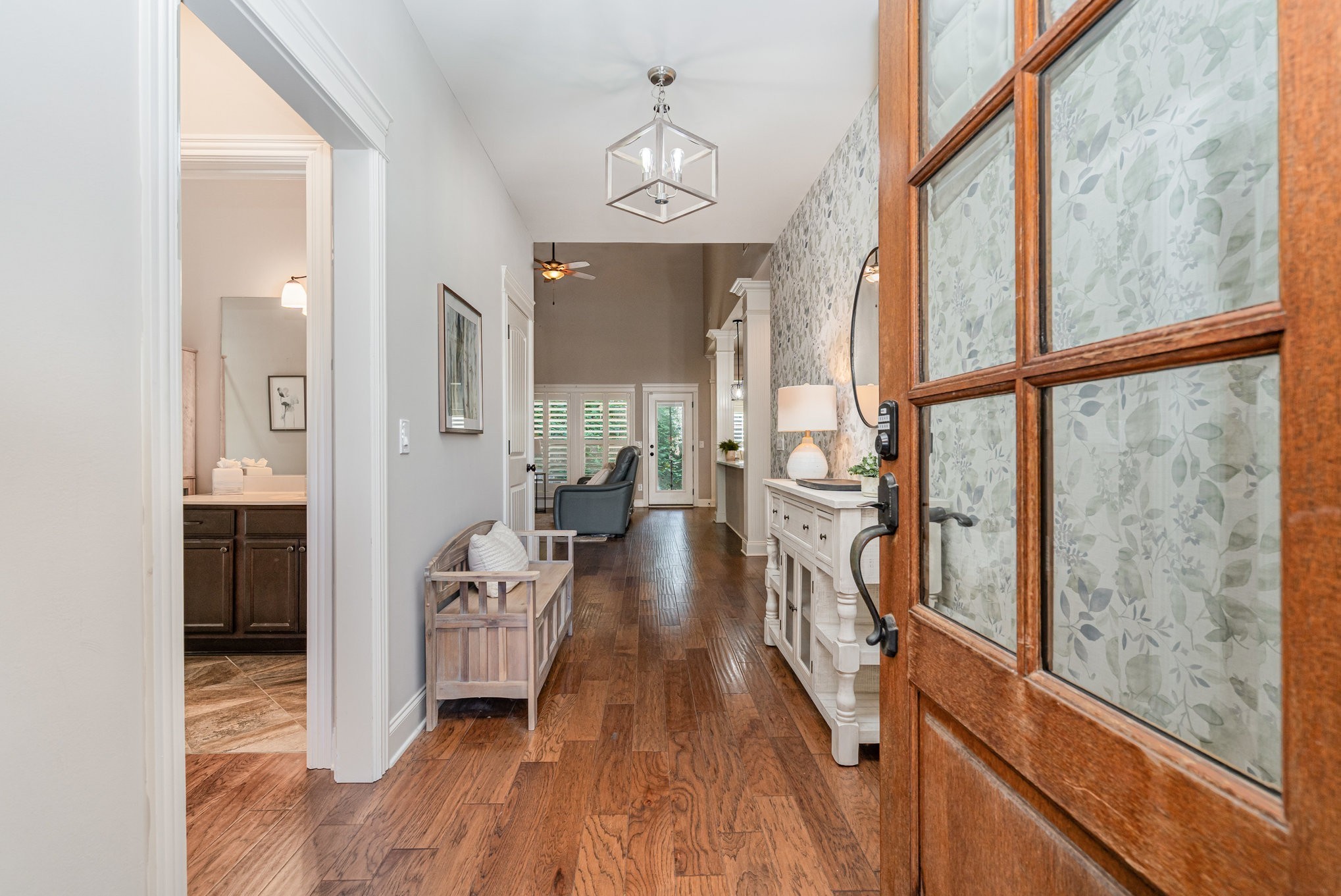 a view of an entryway with wooden floor