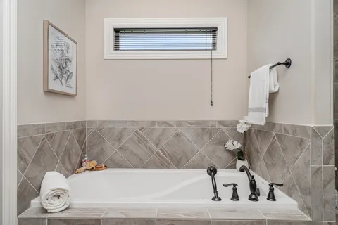 a bathroom with a glass shower door