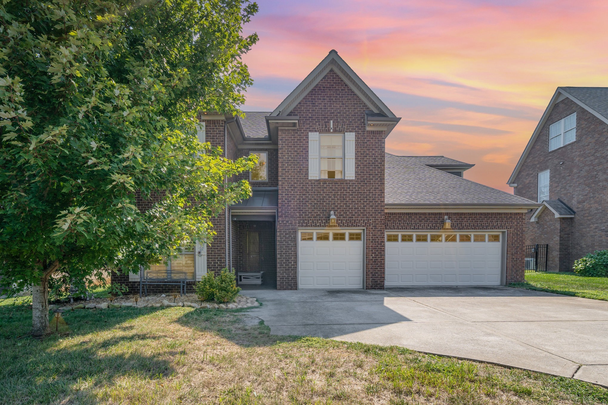5227 Starnes Drive Murfreesboro, TN 37128 - Photo 2 of 29 a front view of a house with a yard and garage