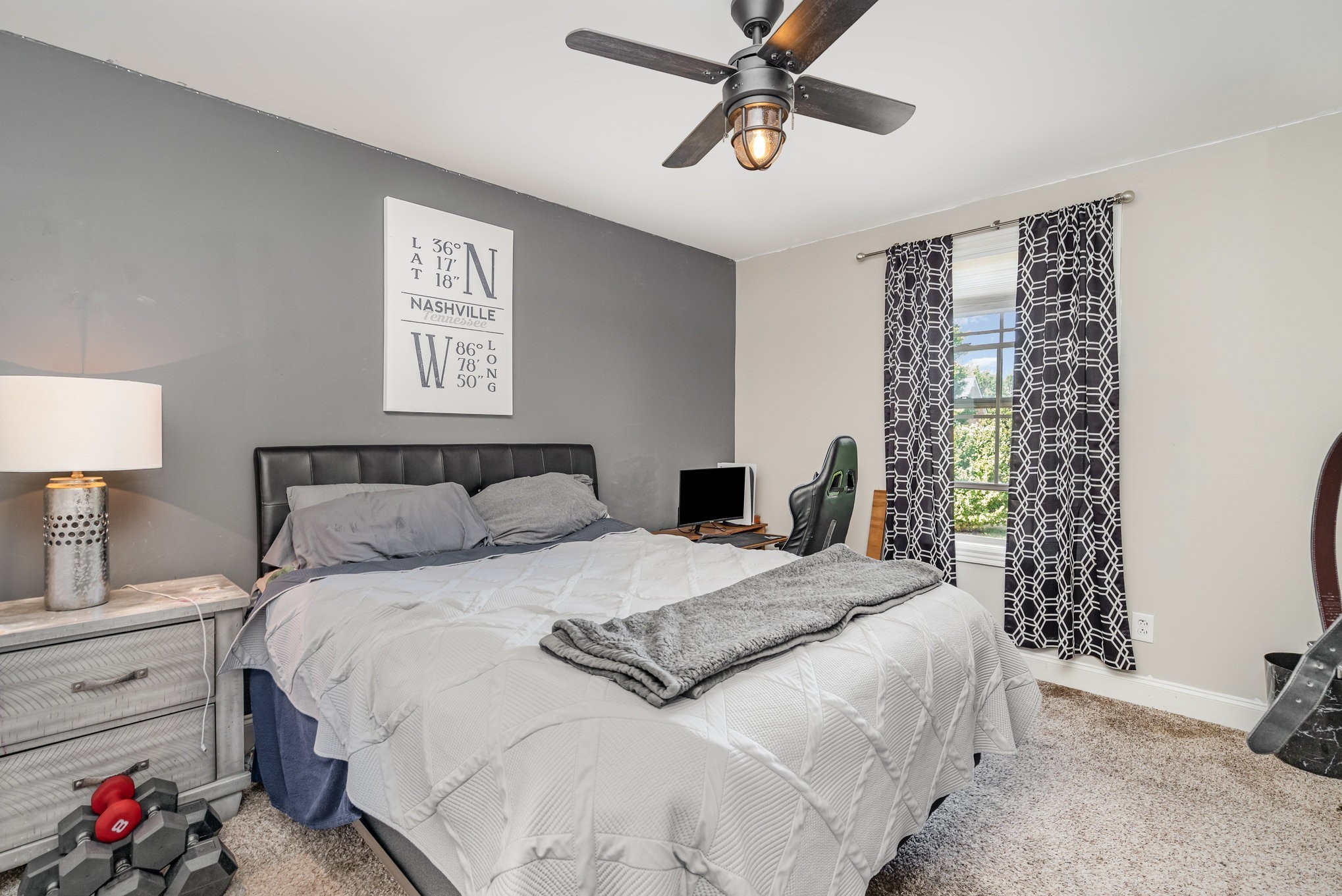 5227 Starnes Drive Murfreesboro, TN 37128 - Photo 23 of 29 a bedroom with a bed and a chandelier
