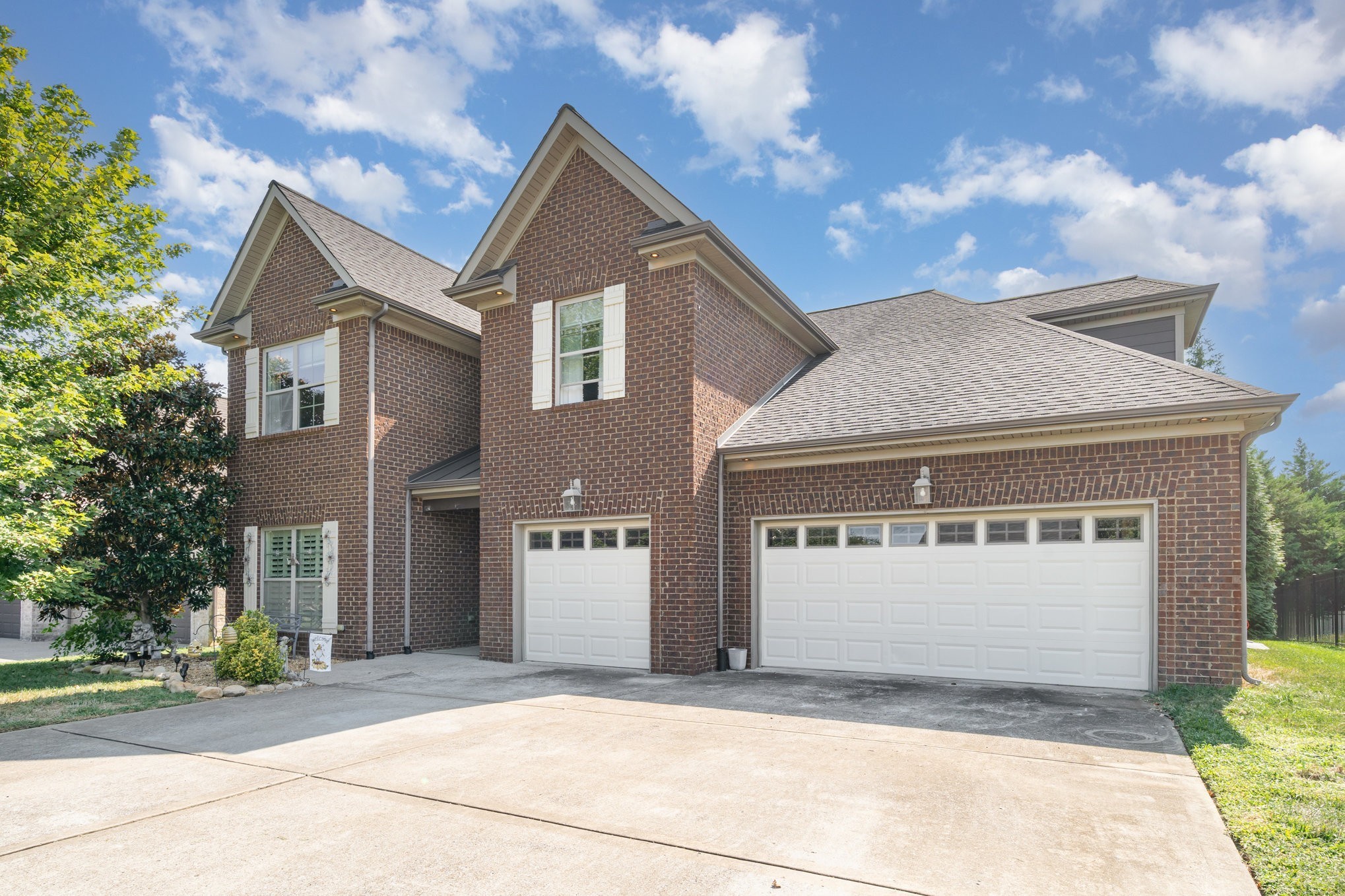 5227 Starnes Drive Murfreesboro, TN 37128 - Photo 26 of 27 a front view of a house with a yard and garage