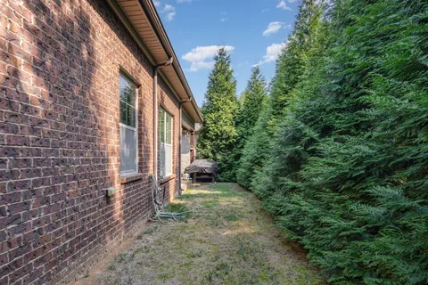 an aerial view of a house with a garden
