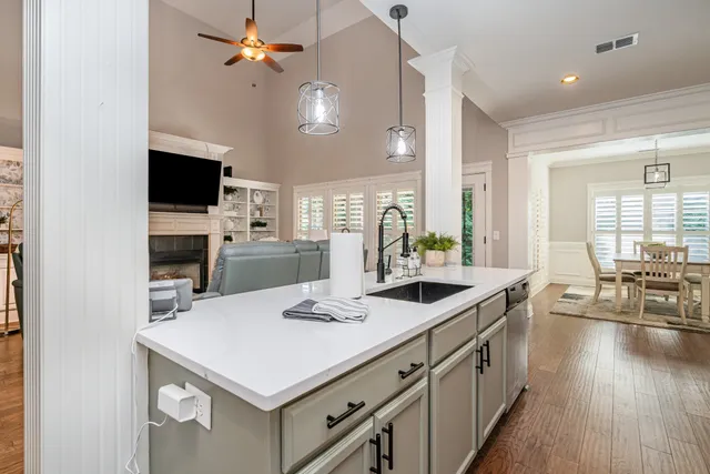 a kitchen with a stove a sink and a refrigerator