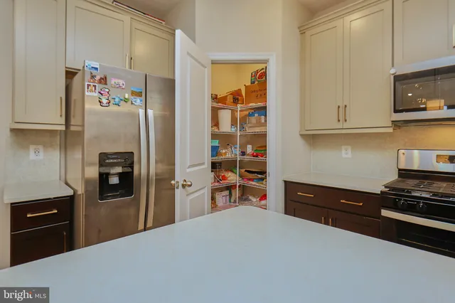 a bathroom with a sink toilet and a mirror