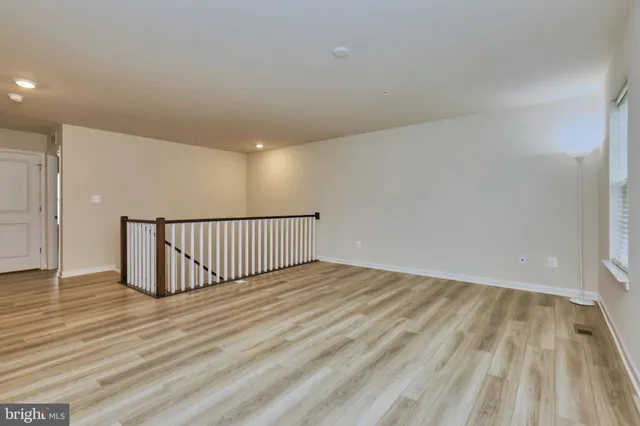 a living room with furniture and windows