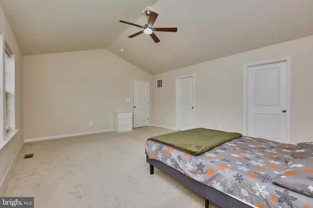 a bathroom with a double vanity sink toilet mirror and shower