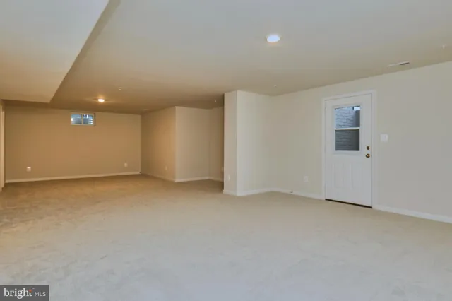 a view of a patio with a table chairs and a fire pit