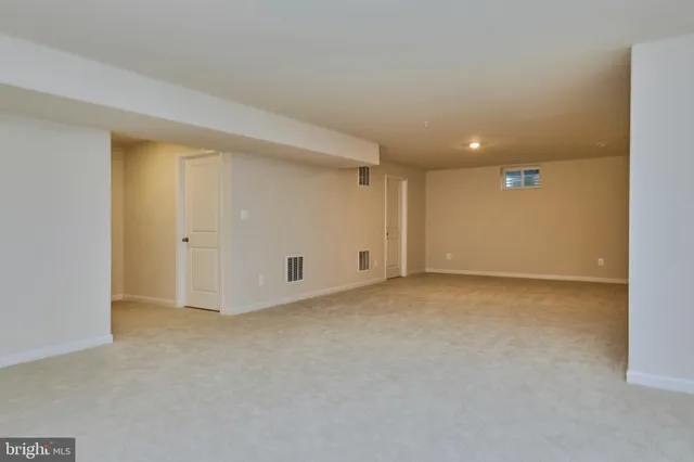 a view of a lake with houses in the back