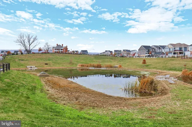 a view of swimming pool with a table and chairs