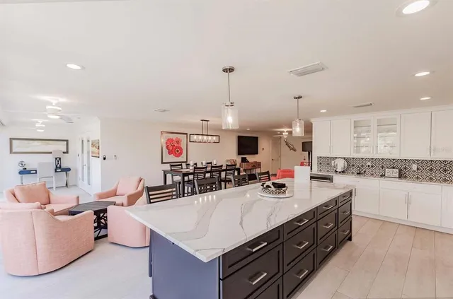 a kitchen with a sink stove and cabinets