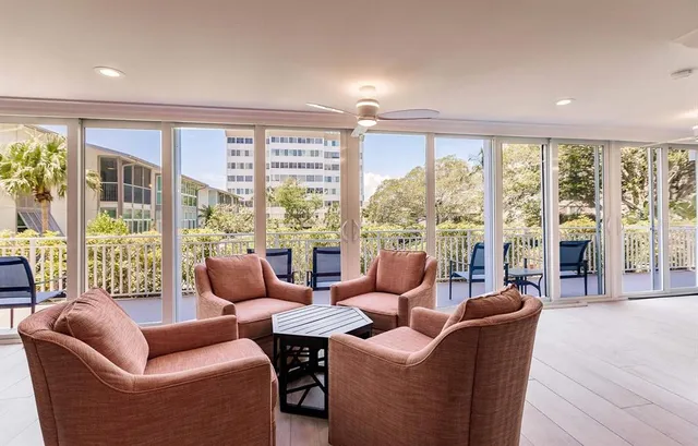 a living room with furniture and windows