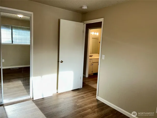a bathroom with a tub and shower