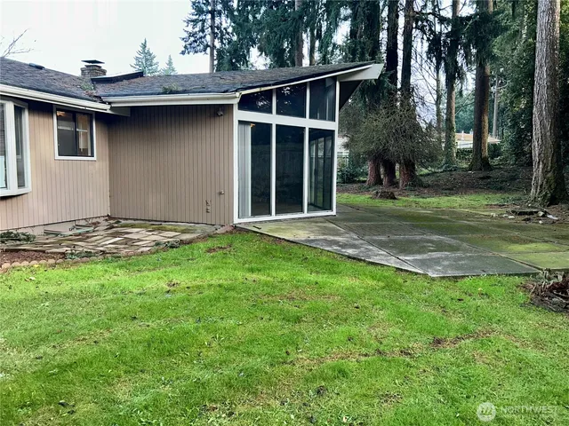 a backyard of a house with lots of green space