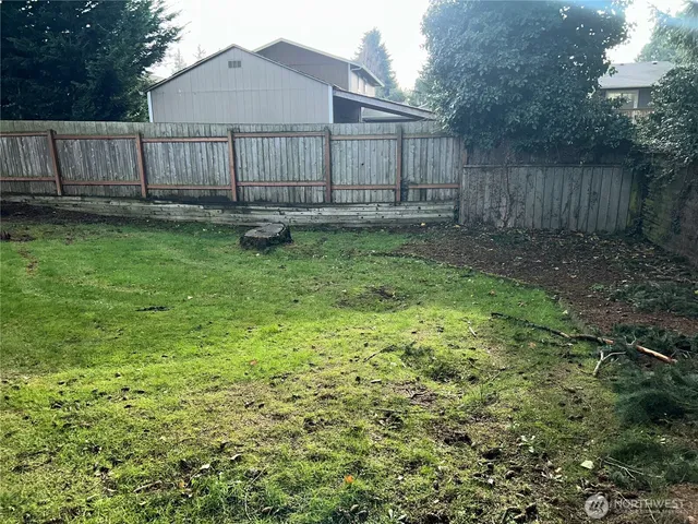 a backyard of a house with lots of green space
