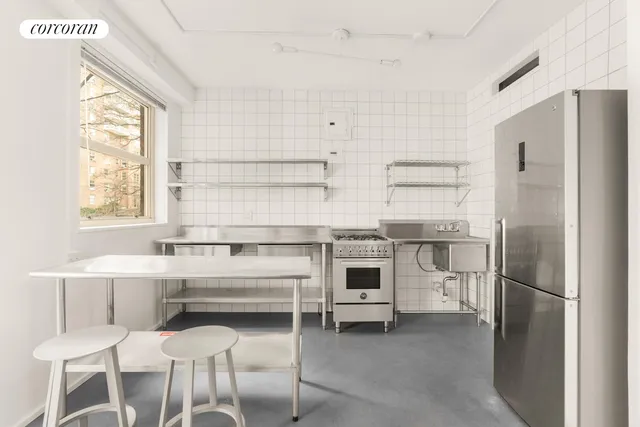 a view of a livingroom with furniture and a window