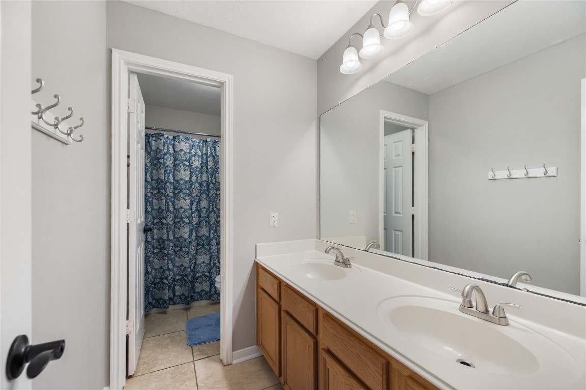 20735 Deauville Drive Spring, TX 77388 - Photo 22 of 33 The third full bathroom also offers dual sinks, providing convenience and ample space for family and guests.