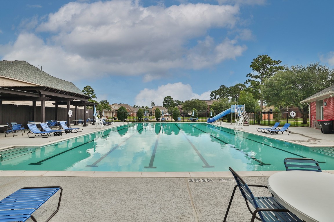 20735 Deauville Drive Spring, TX 77388 - Photo 31 of 33 The sparkling community pool offers a refreshing retreat for all ages, surrounded by lounge areas perfect for soaking up the sun or socializing with neighbors.