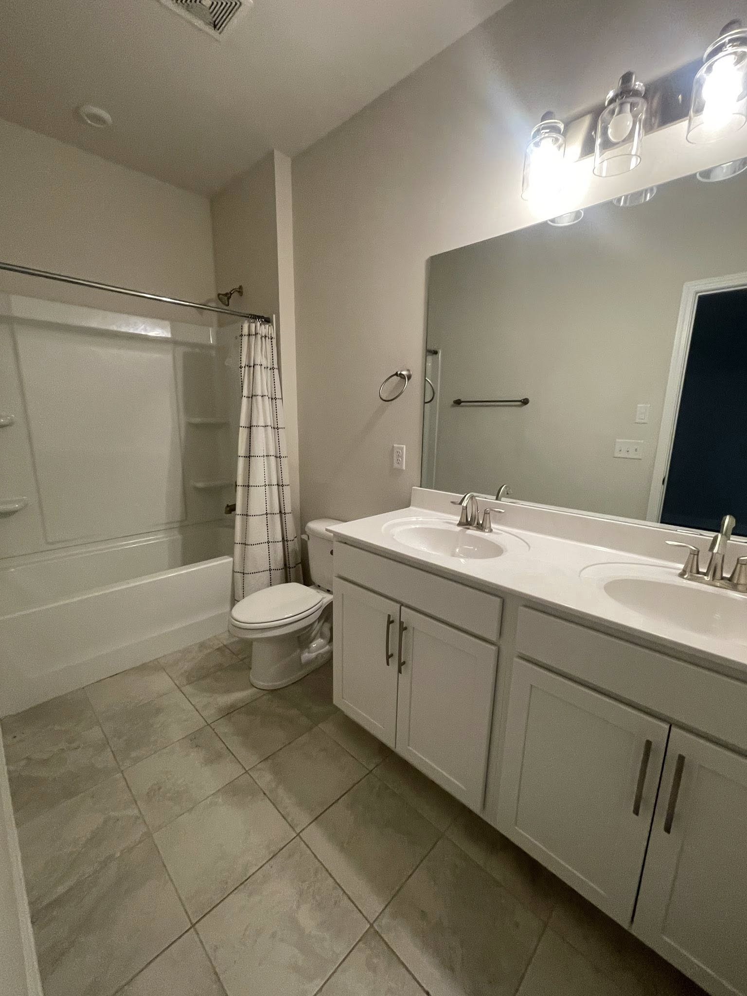2119 Neill Lane White House, TN 37188 - Photo 13 of 16 a spacious bathroom with a double vanity sink toilet mirror and shower