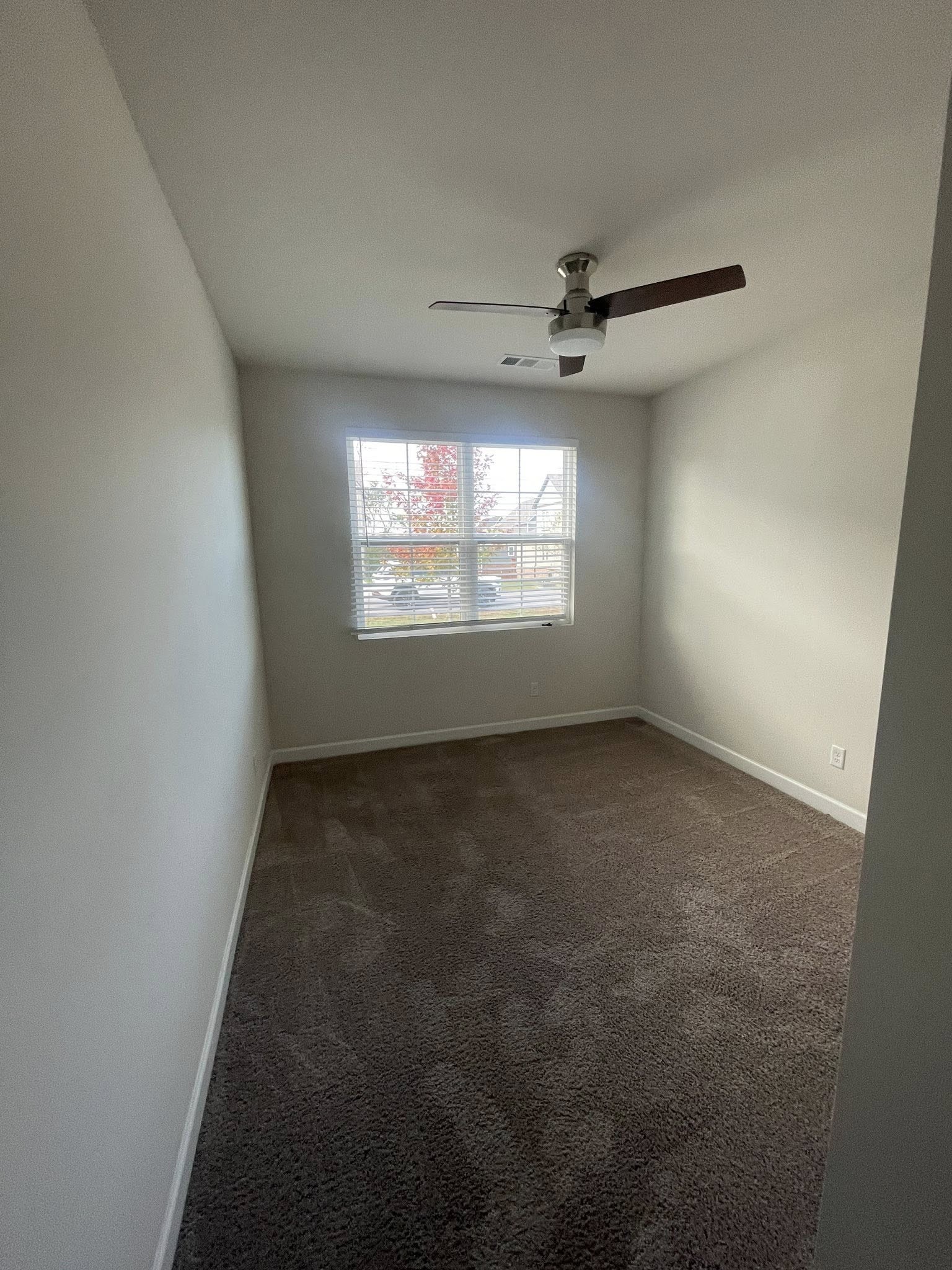 2119 Neill Lane White House, TN 37188 - Photo 14 of 16 an empty room with windows ceiling fan and windows