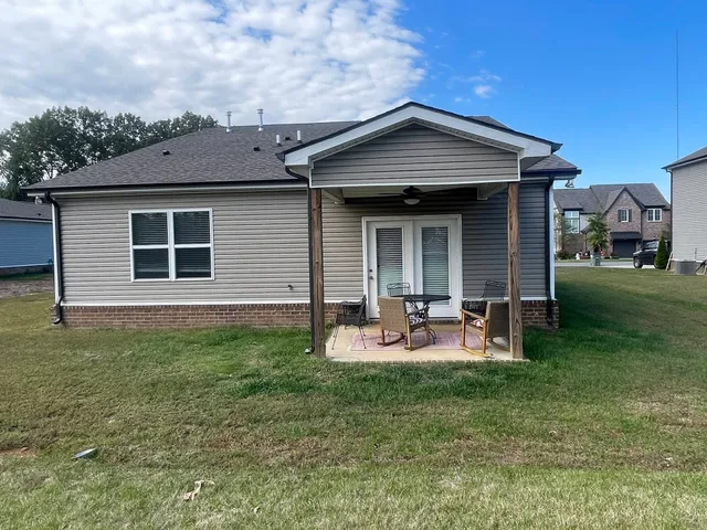 a front view of house with yard and seating area