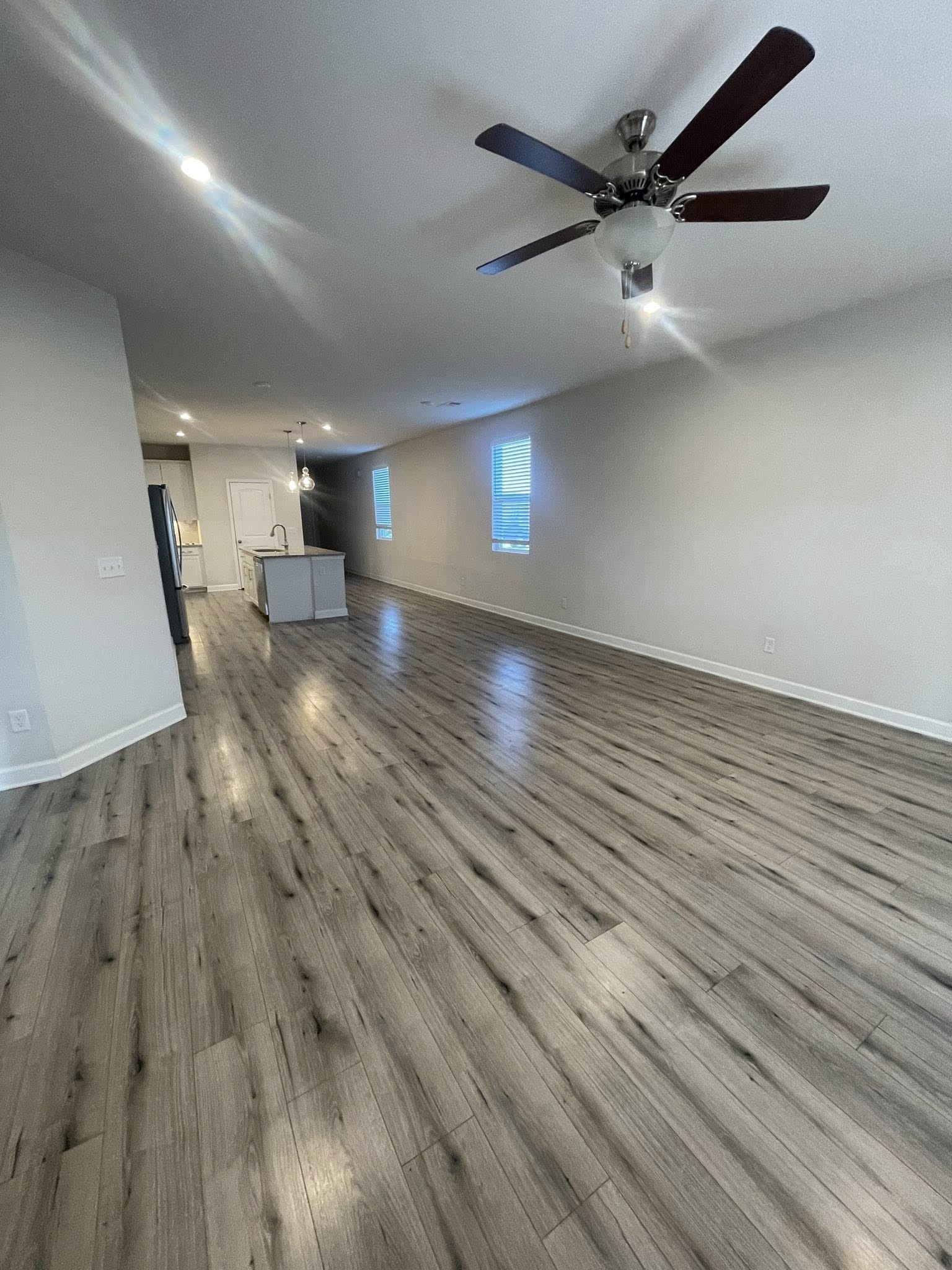 2119 Neill Lane White House, TN 37188 - Photo 7 of 16 an empty room with wooden floor and a ceiling fan