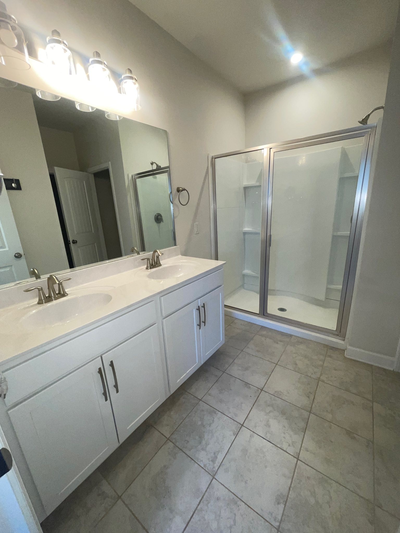 2119 Neill Lane White House, TN 37188 - Photo 9 of 16 a spacious bathroom with a double vanity sink mirror and shower