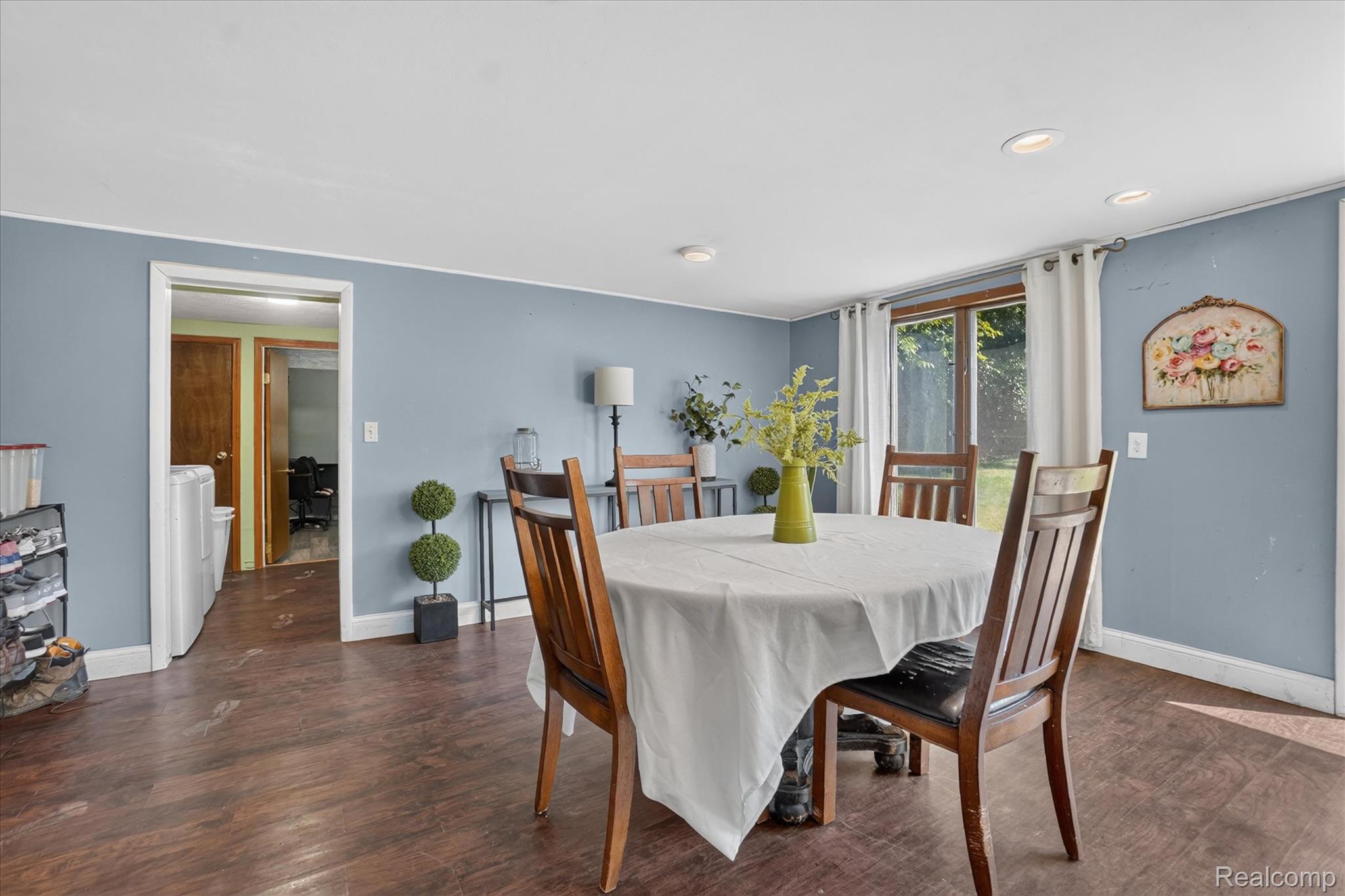 508 Deland Road Flushing, MI 48433 - Photo 12 of 38 Expansive room featuring wood-finish flooring, recessed lighting, and a large window providing natural light