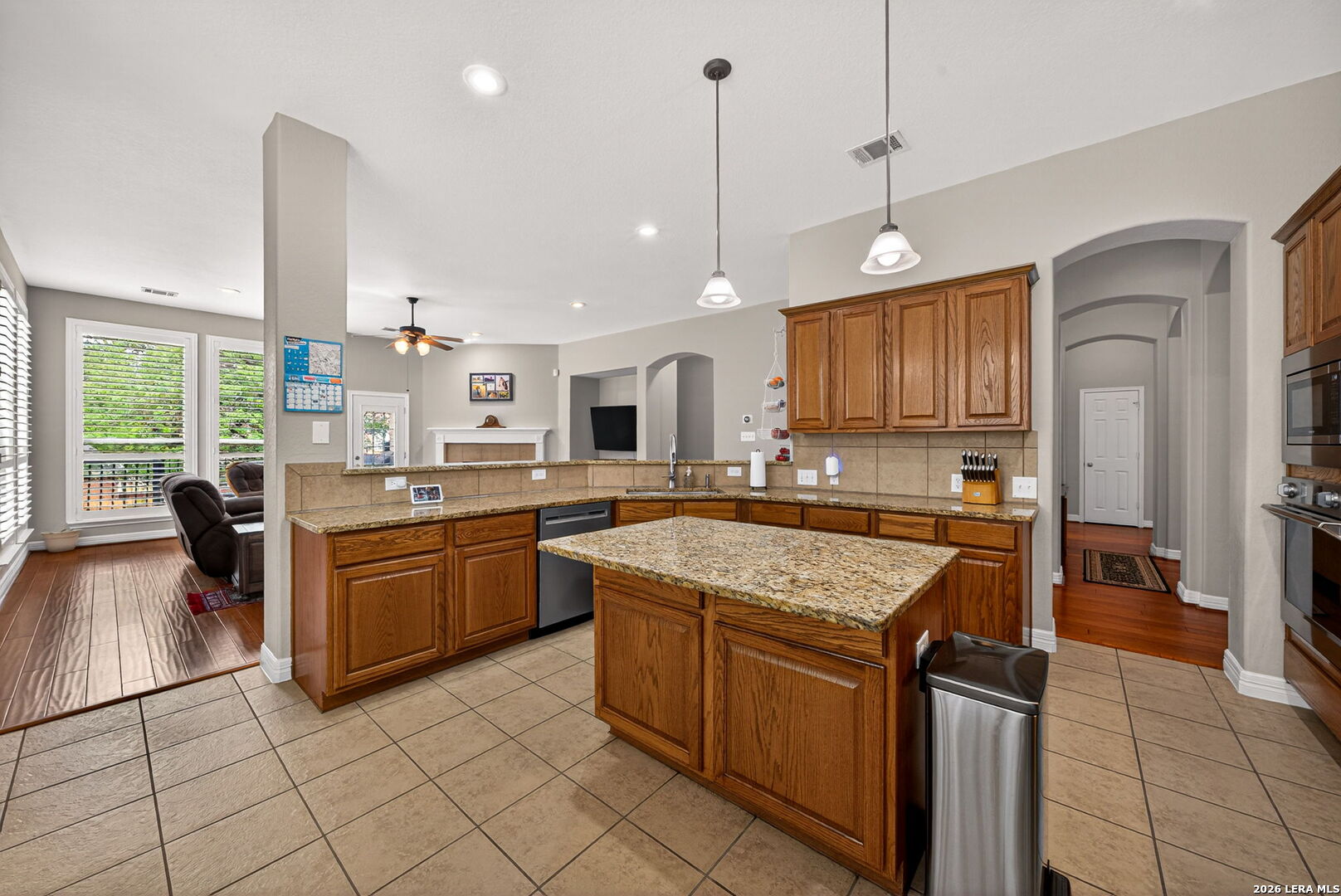 8715 Rancho De Taos Helotes, TX 78023 - Photo 12 of 40 a kitchen with a stove sink and cabinets