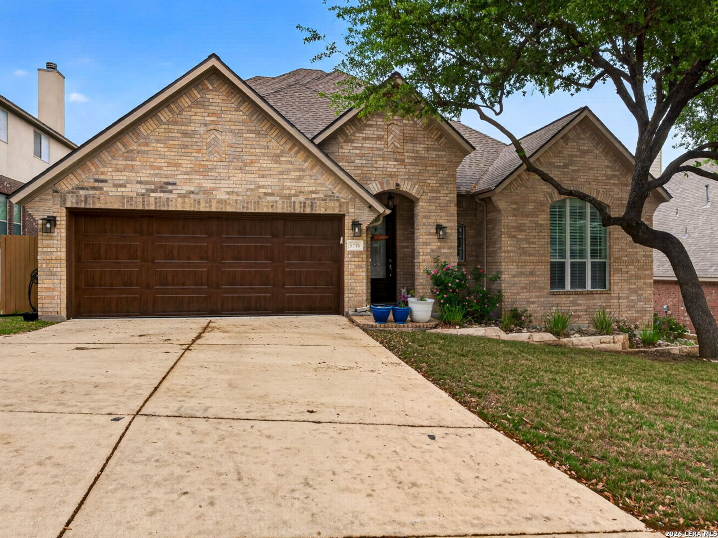 8715 Rancho De Taos Helotes, TX 78023 - Photo 40 of 40 a front view of a house with a yard