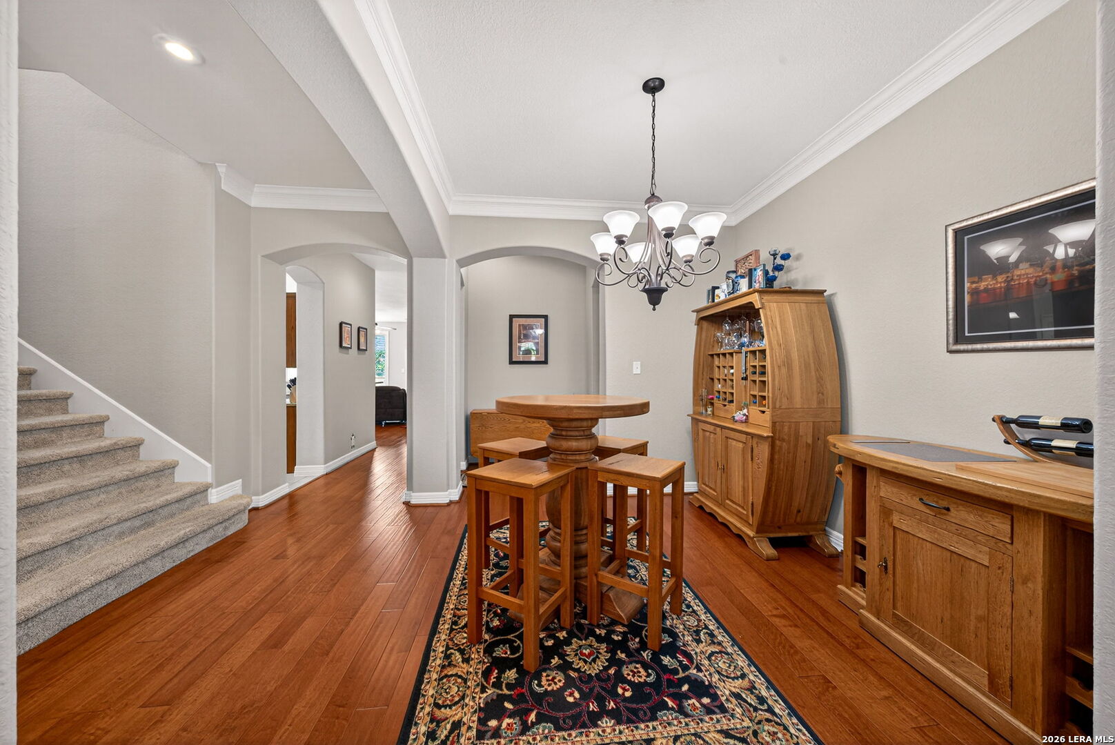 8715 Rancho De Taos Helotes, TX 78023 - Photo 6 of 40 a view of a dining room with furniture and wooden floor
