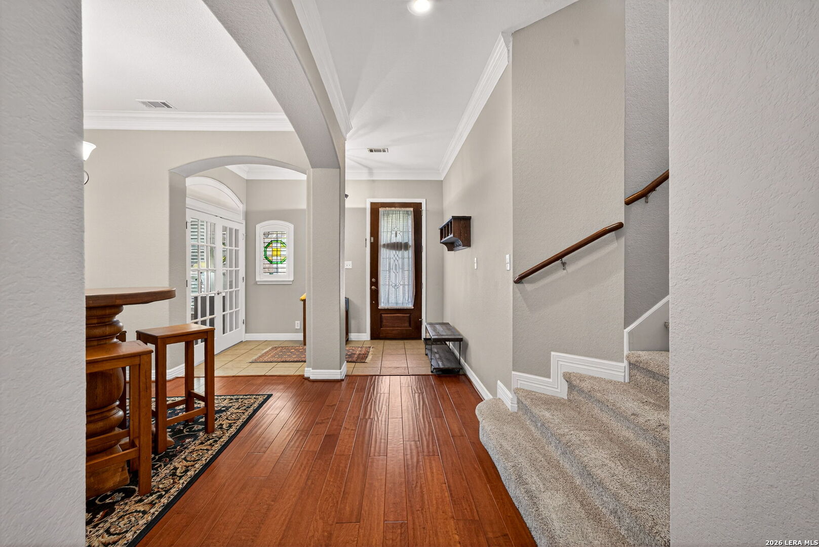 8715 Rancho De Taos Helotes, TX 78023 - Photo 10 of 40 a view of a hallway with wooden floor and furniture