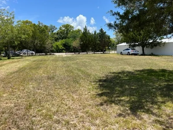 a view of outdoor space with deck and yard