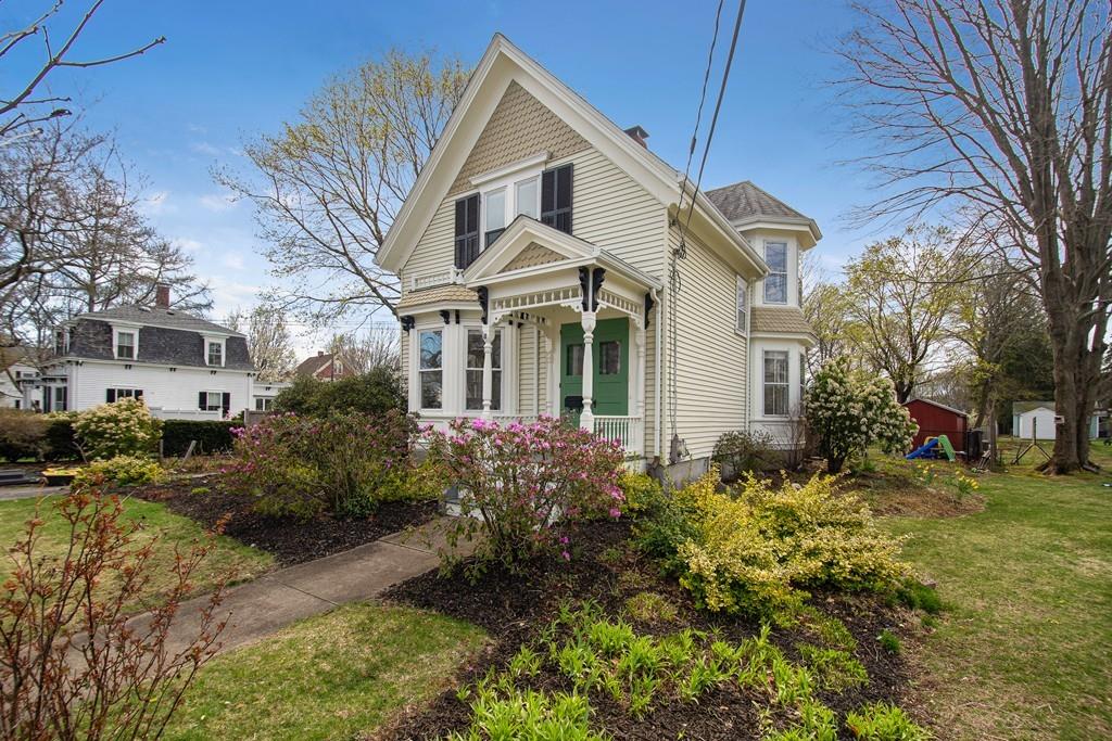 a front view of a house with garden