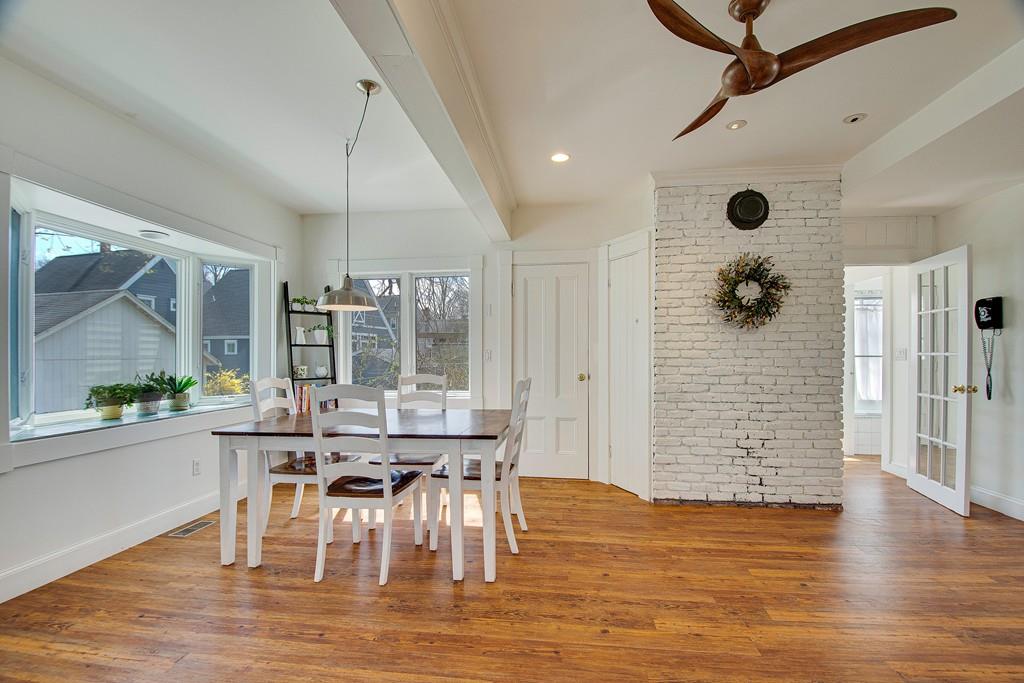 86 Pond Street Natick, MA 01760 - Photo 13 of 33 a view of a dining room with furniture and wooden floor