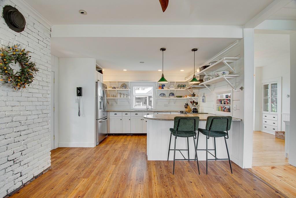 86 Pond Street Natick, MA 01760 - Photo 14 of 33 a kitchen with a table and chairs in it