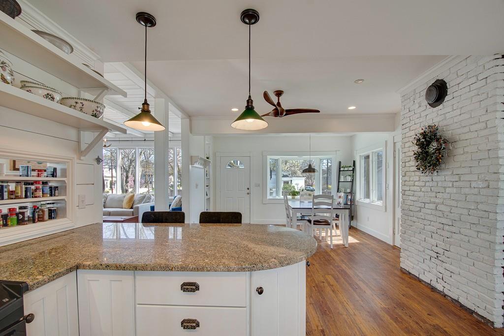 86 Pond Street Natick, MA 01760 - Photo 17 of 33 a view of a kitchen with kitchen island a counter top space a sink and cabinets