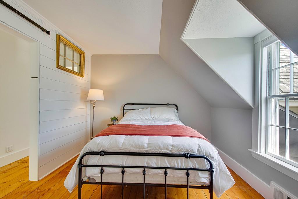 86 Pond Street Natick, MA 01760 - Photo 20 of 33 a bedroom with a bed and a window