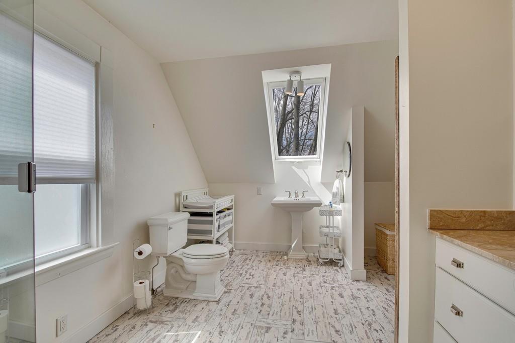 86 Pond Street Natick, MA 01760 - Photo 22 of 33 a bathroom with a toilet sink and shower