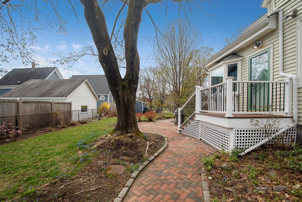 86 Pond Street Natick, MA 01760 - Photo 30 of 33 a view of a house with a yard