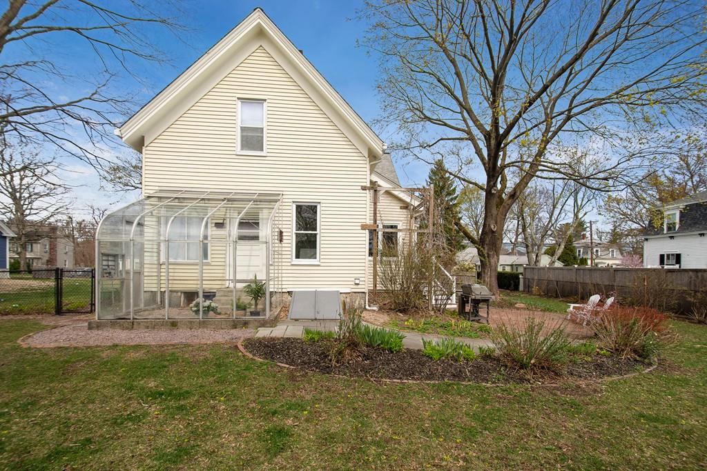 86 Pond Street Natick, MA 01760 - Photo 33 of 33 a view of a white house with a yard