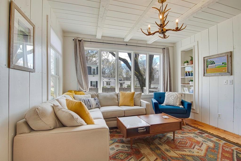 86 Pond Street Natick, MA 01760 - Photo 8 of 33 a living room with furniture and a large window