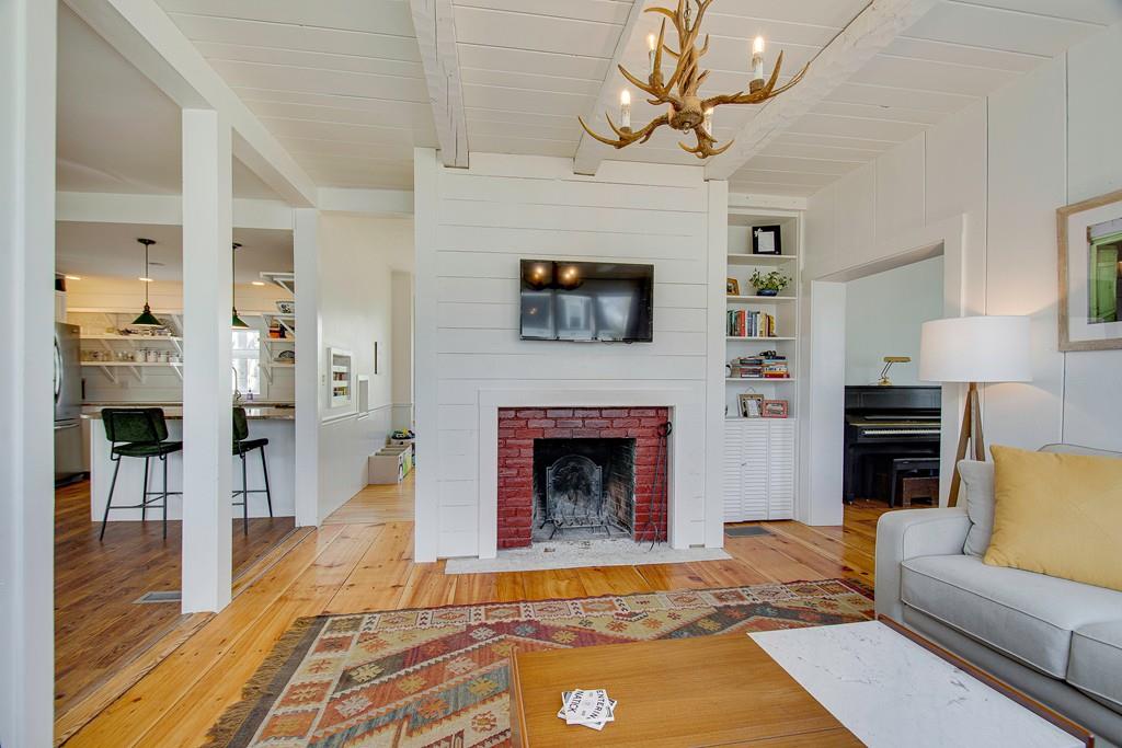 86 Pond Street Natick, MA 01760 - Photo 10 of 33 a living room with furniture a fireplace and flat screen tv